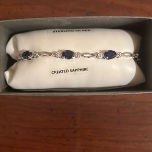 A sterling silver bracelet with sapphire gems